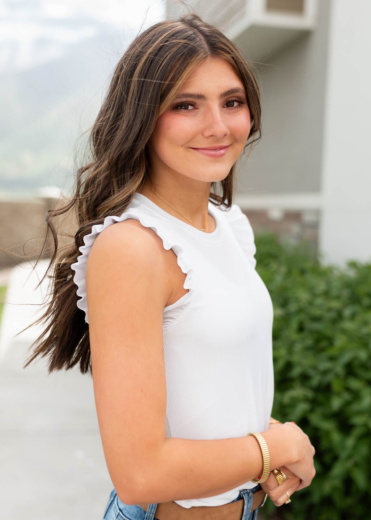 Side view of the white crop sleeve top