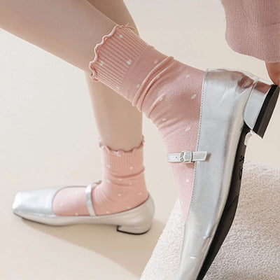 Side view of the pink polka dot socks