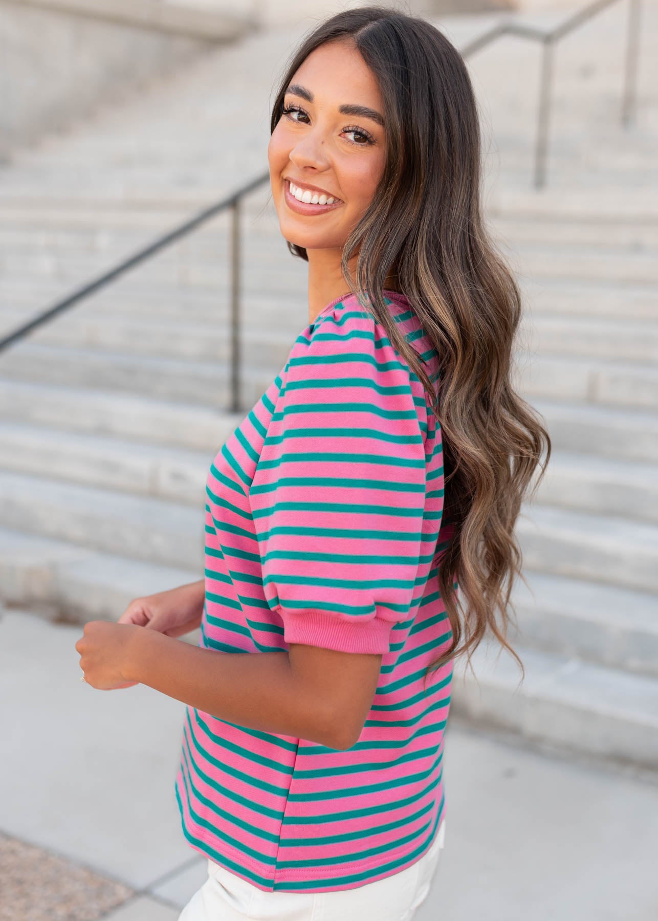 Side view of the pink and teal striped top
