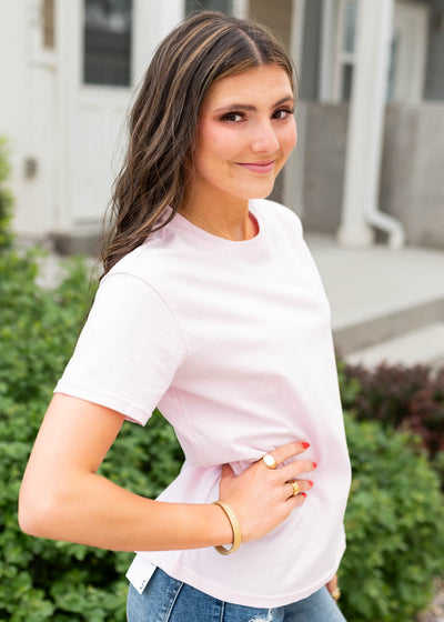 Side view of the pink basic tee
