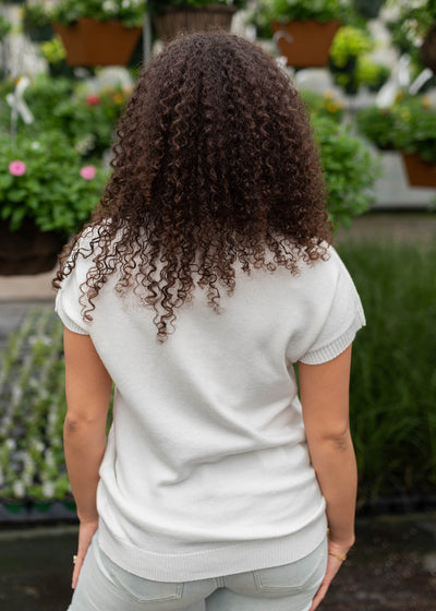 Back view of the black bow sweater