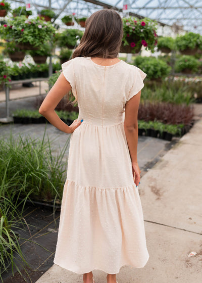 Back view of the beige swiss dot dress