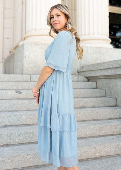 Side view of the Rea light blue dress with short sleeves
