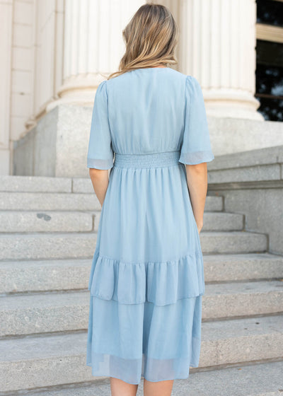 Back view of a modest light blue dress with elastic waist