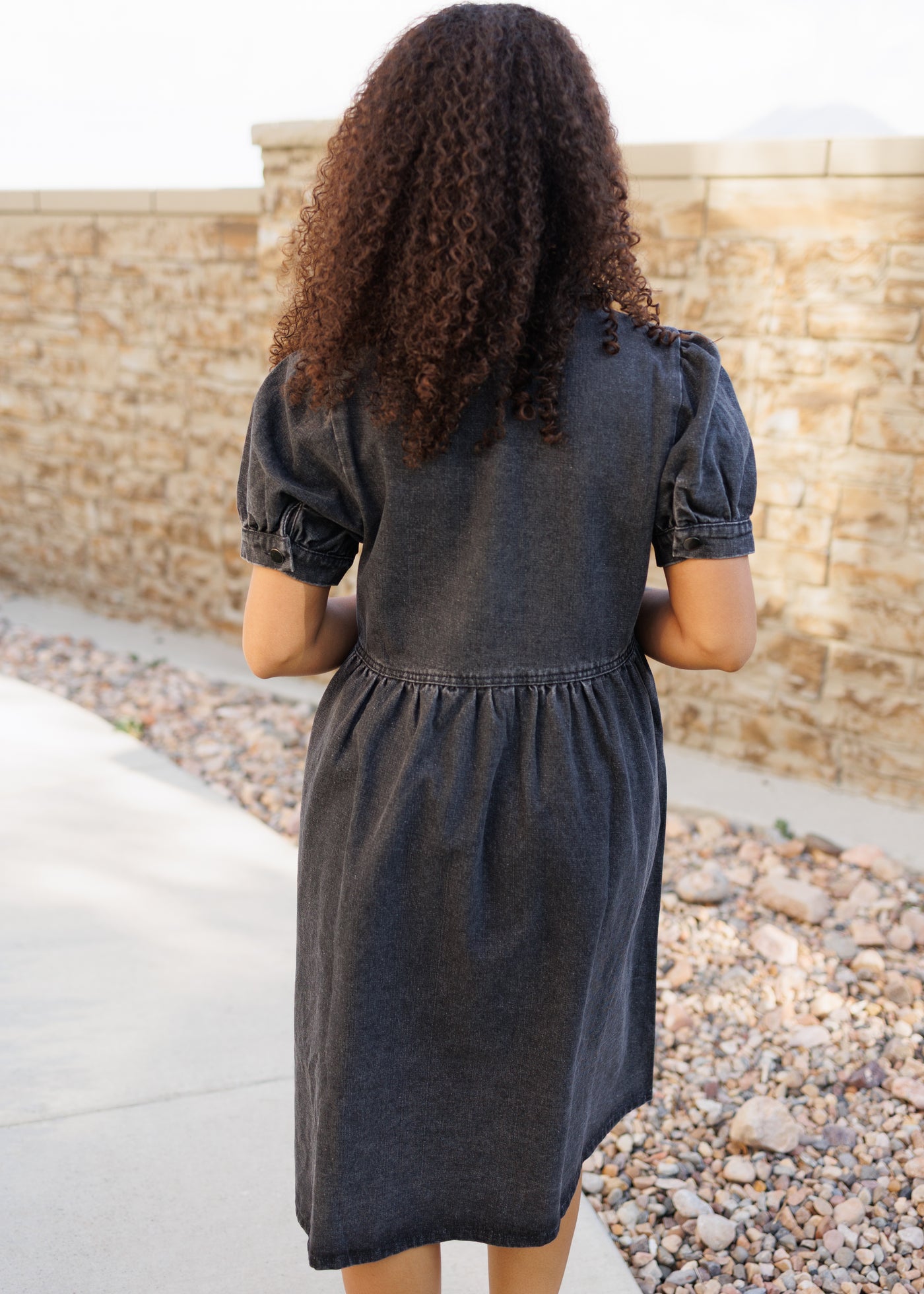 Back view of the black denim dress