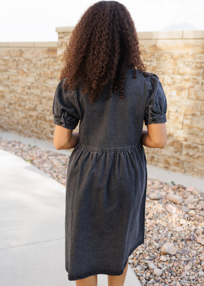 Back view of the black denim dress