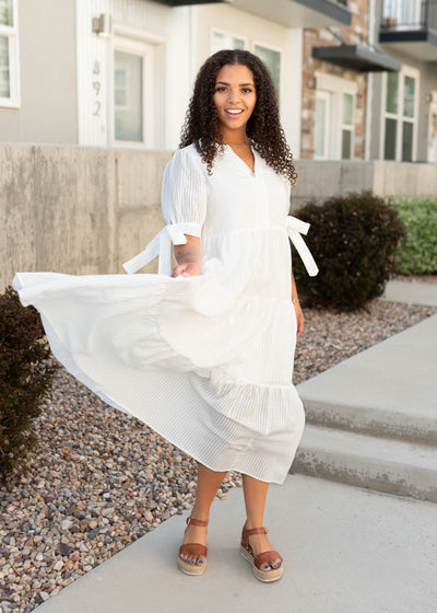 White gingham dress with a tiered skirt
