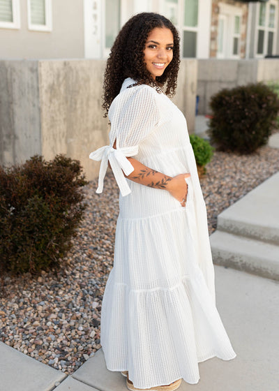 Side view of the white gingham dress with pockets
