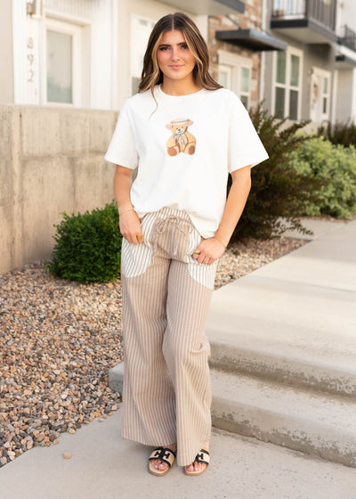Elastic waist and tie on the taupe pinstripe pants