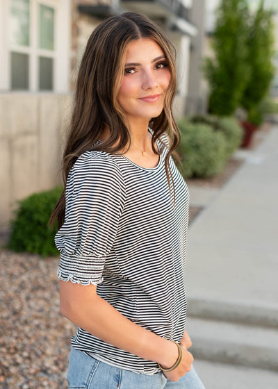 Side view of the navy striped top