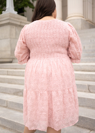 Back view of the plus size blush floral textured dress