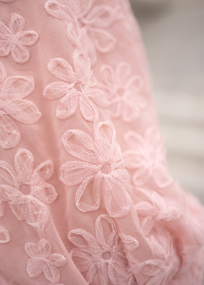 Close up of the flower fabric on the blush floral textured dress