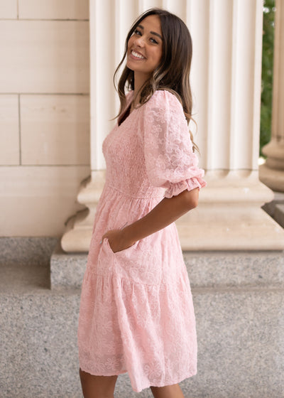 Side view of the modest blush floral textured dress with pockets at Lena Layne