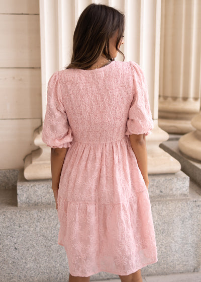 Back view of the blush floral textured dress