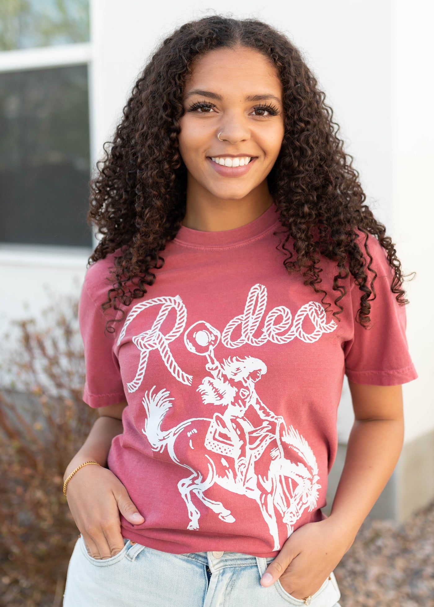 Front view of the rodeo cowgirl graphic tee
