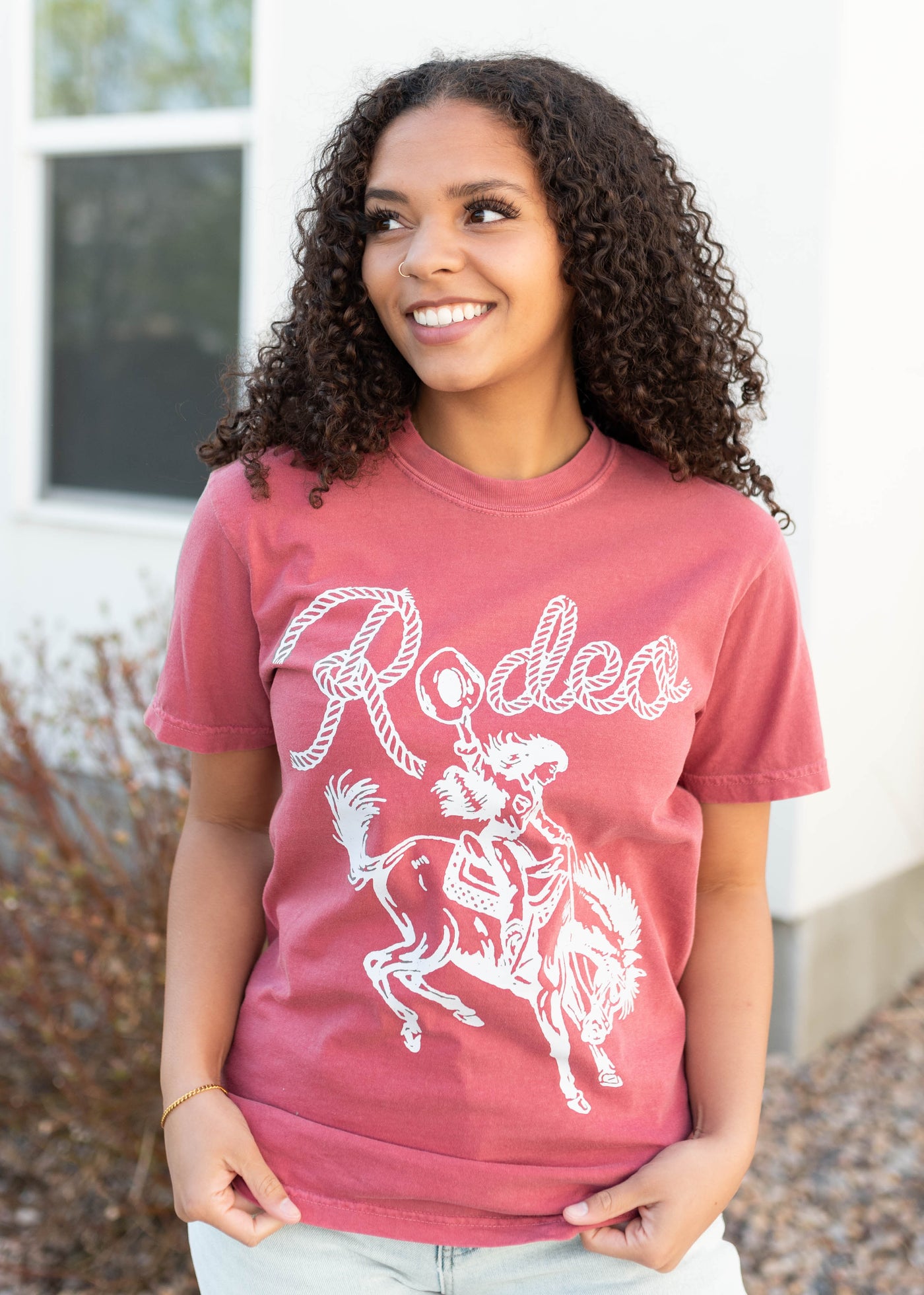 White graphics on the rodeo cowgirl graphic tee