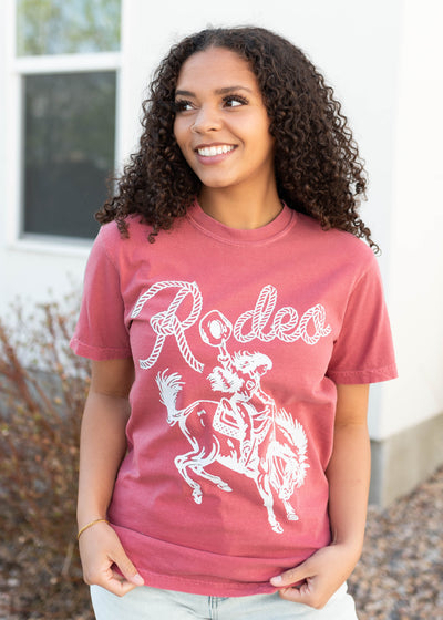 White graphics on the rodeo cowgirl graphic tee