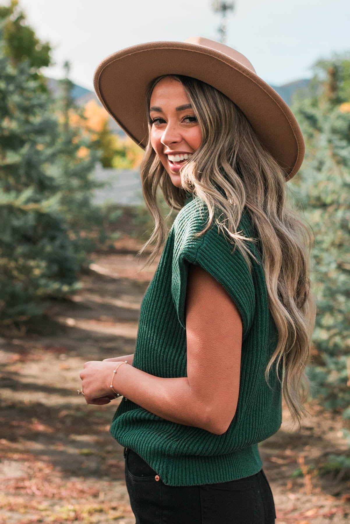 Side view of the hunter green sweater