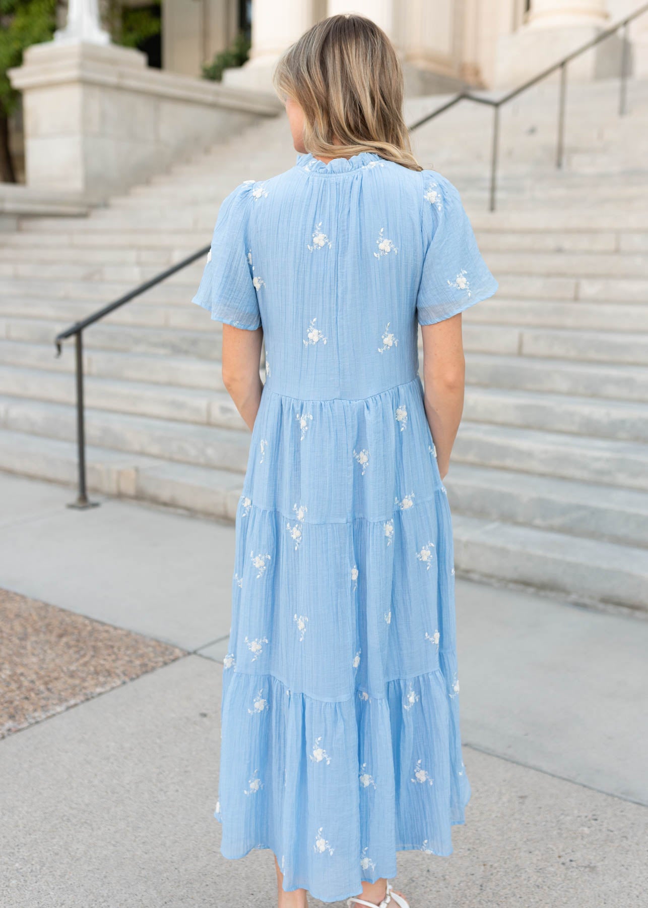 Back view of the blue floral dress at Lena Layne