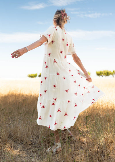 Back view of the ivory floral dress with red flowers