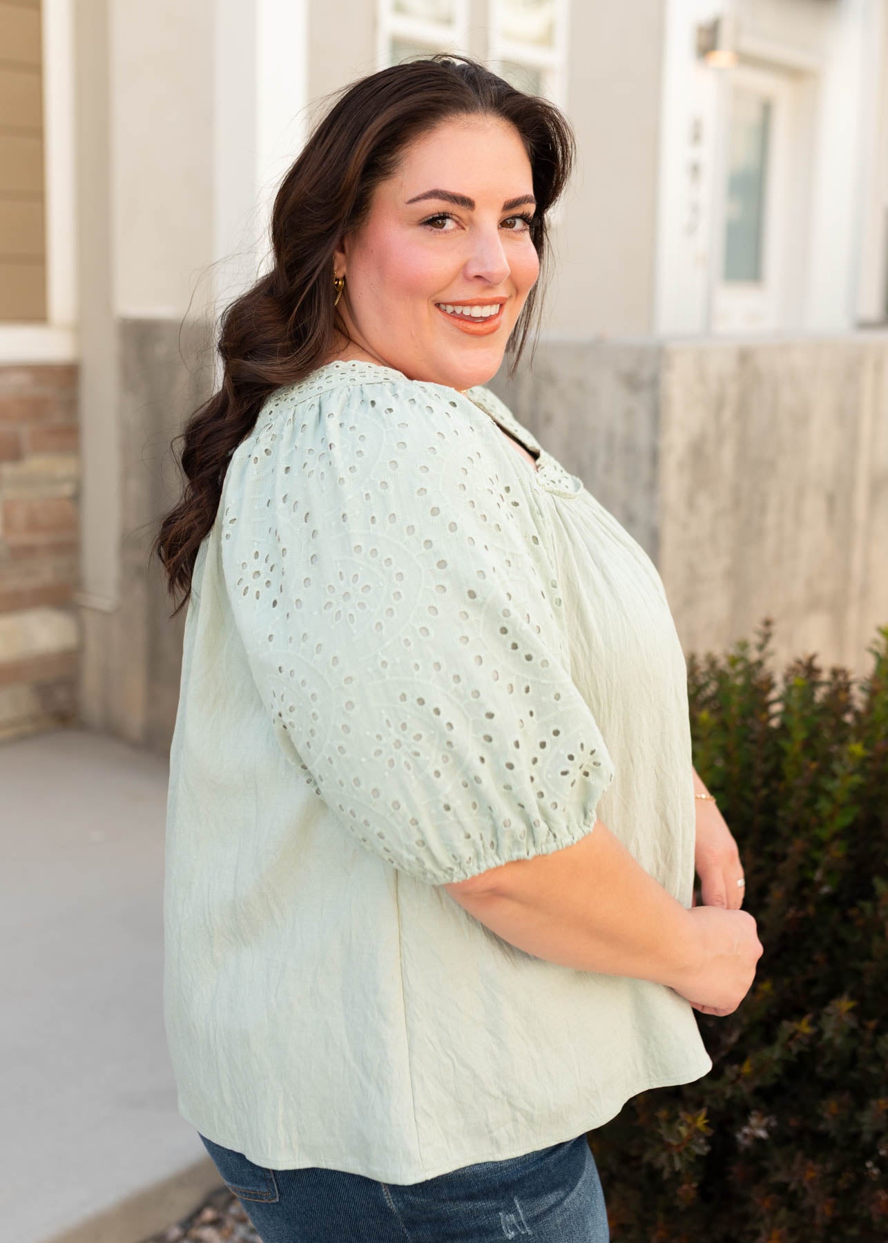 Side view of the modest plus size sage top