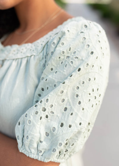 Close up of the eyelet sleeves on the sage top