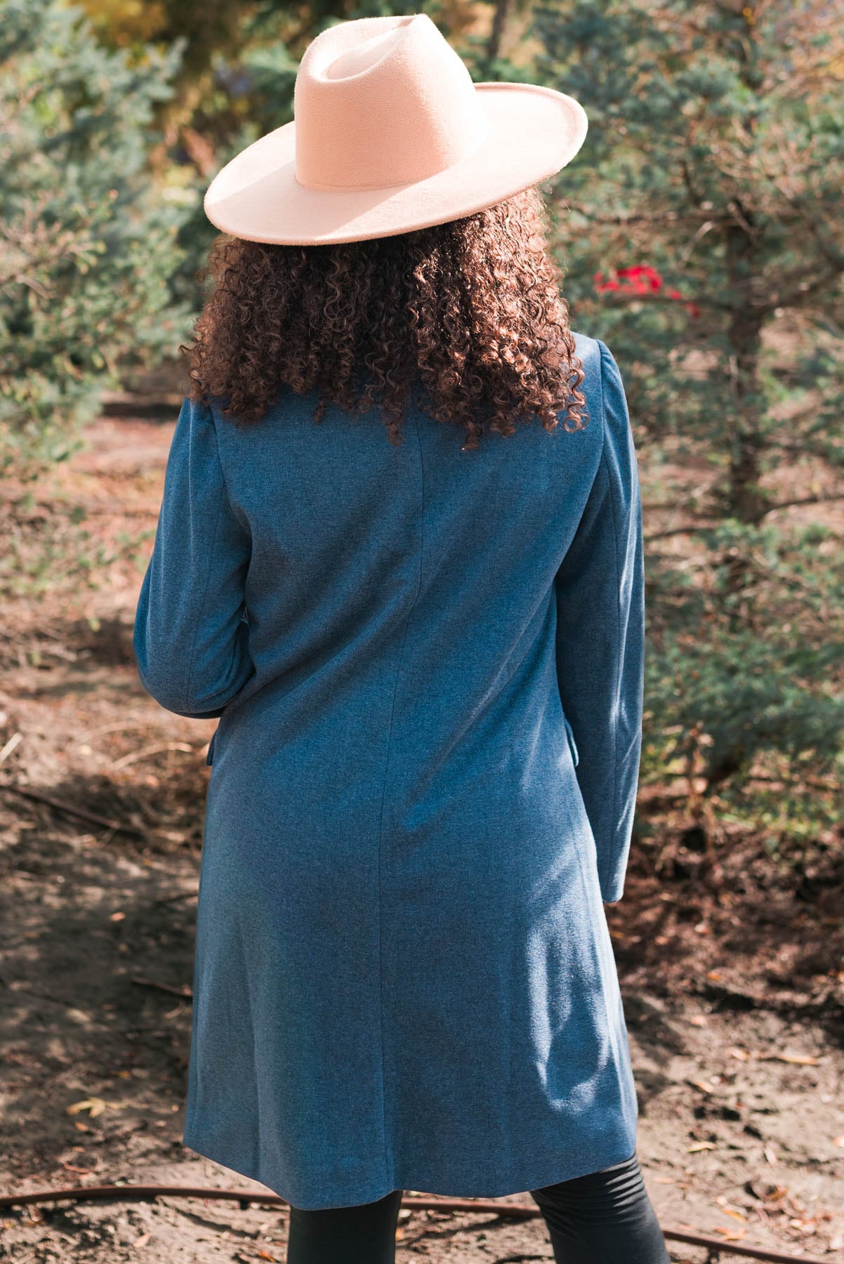 Back view of the long indigo coat