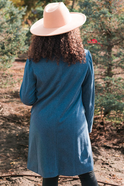 Back view of the long indigo coat