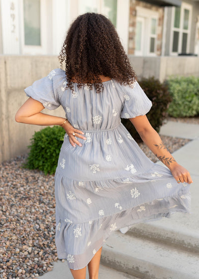 Back view of the dusty blue embroideted dress