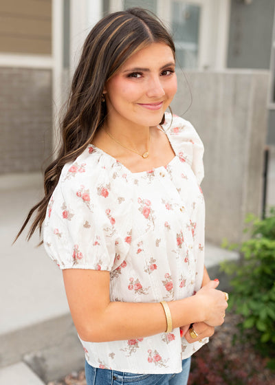 Side view of the ivory floral top
