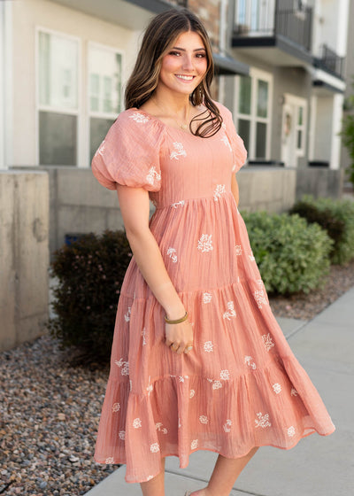 Side view of the terracotta embroidered dress