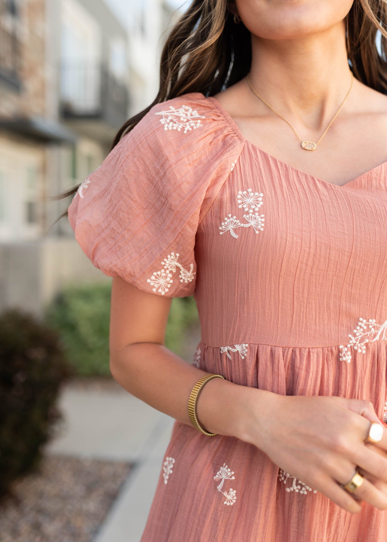 Close up of the fabric and sleeve on the terracotta dress