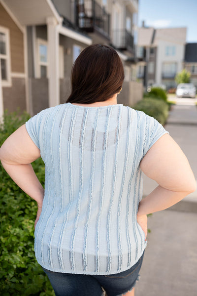 Back view of the plus size blue textured top