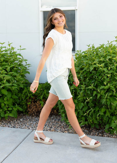 Side view of the white textured top