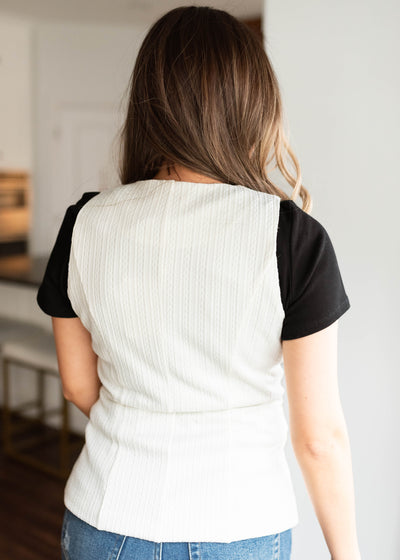 Back view of the cream cardigan vest