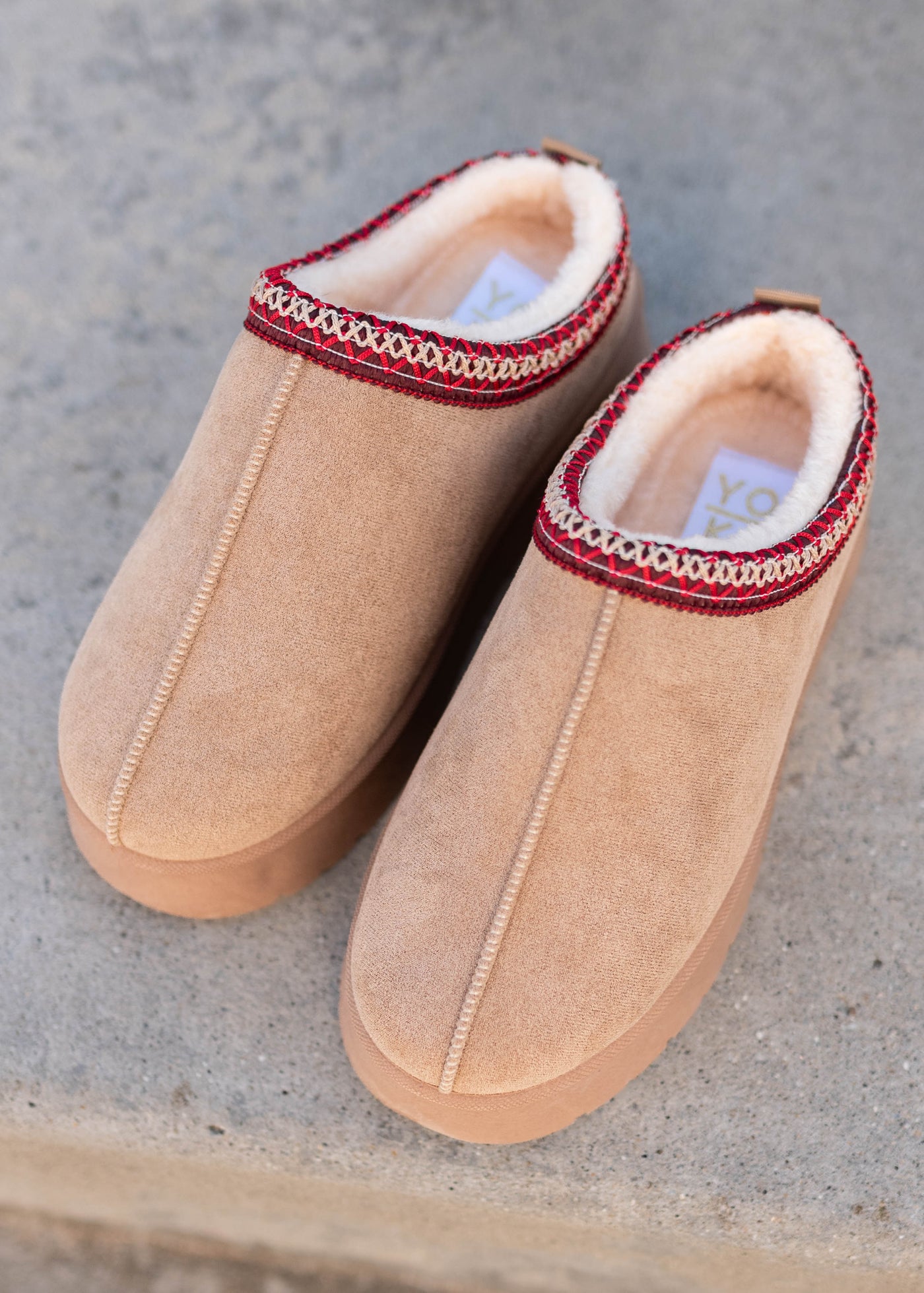 Front view of the beige platform clogs