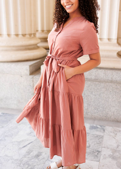 Side view of the dark blush bow tie dress with pockets