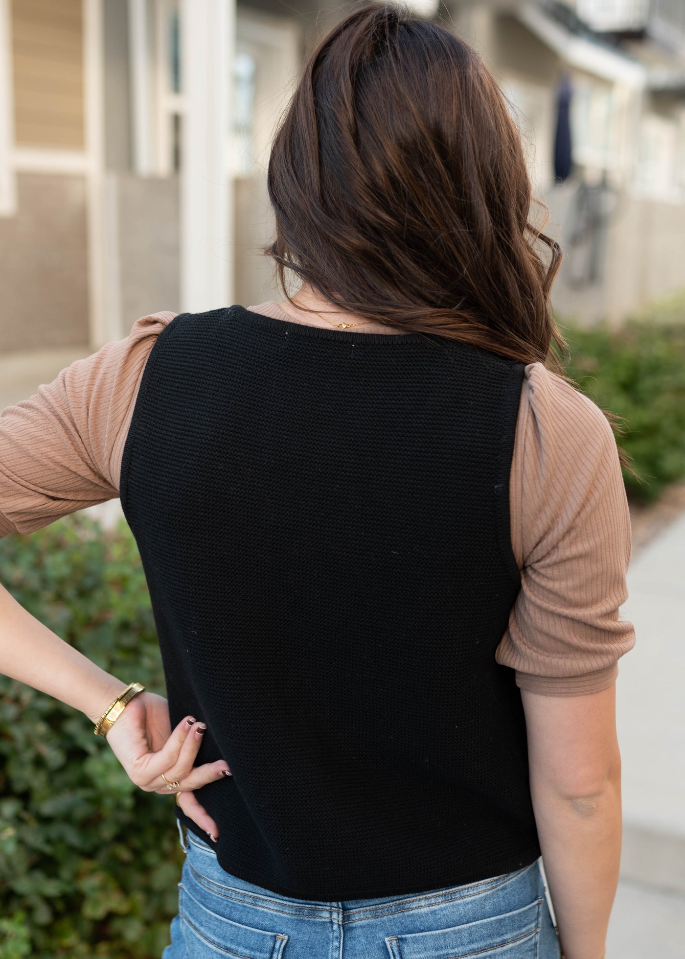 Back view black knit sweater vest