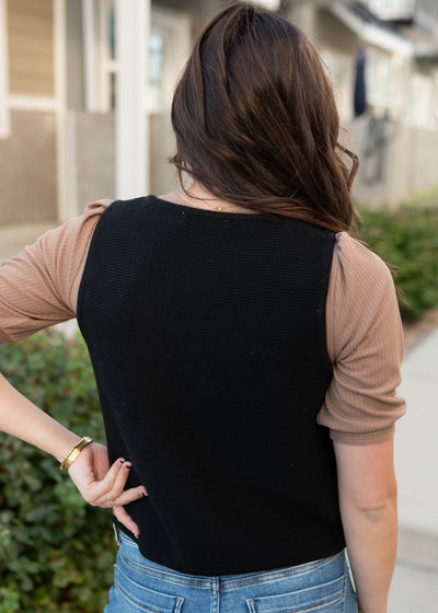 Back view black knit sweater vest