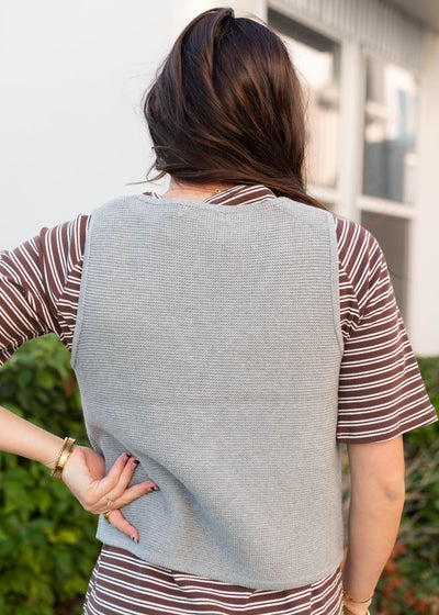 Back view of the grey knit sweater vest
