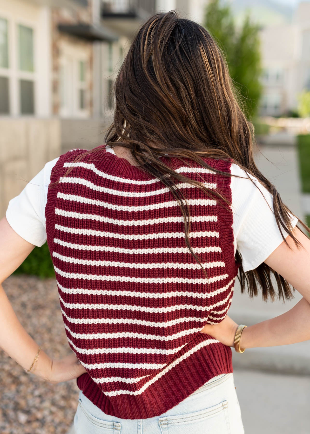 Back view of the burgundy stripe sweater vest