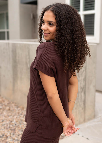 Side view of the brown ribbed sweater