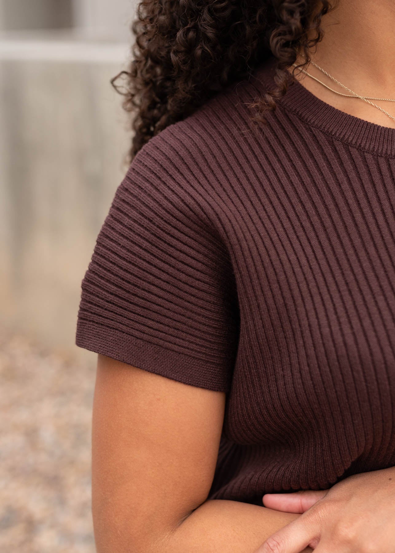 Close up of the sleeve on the brown ribbed sweater