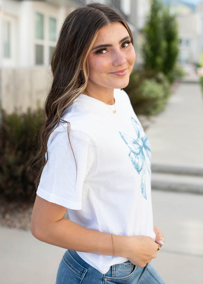 Side view of the white blue bow graphic tee