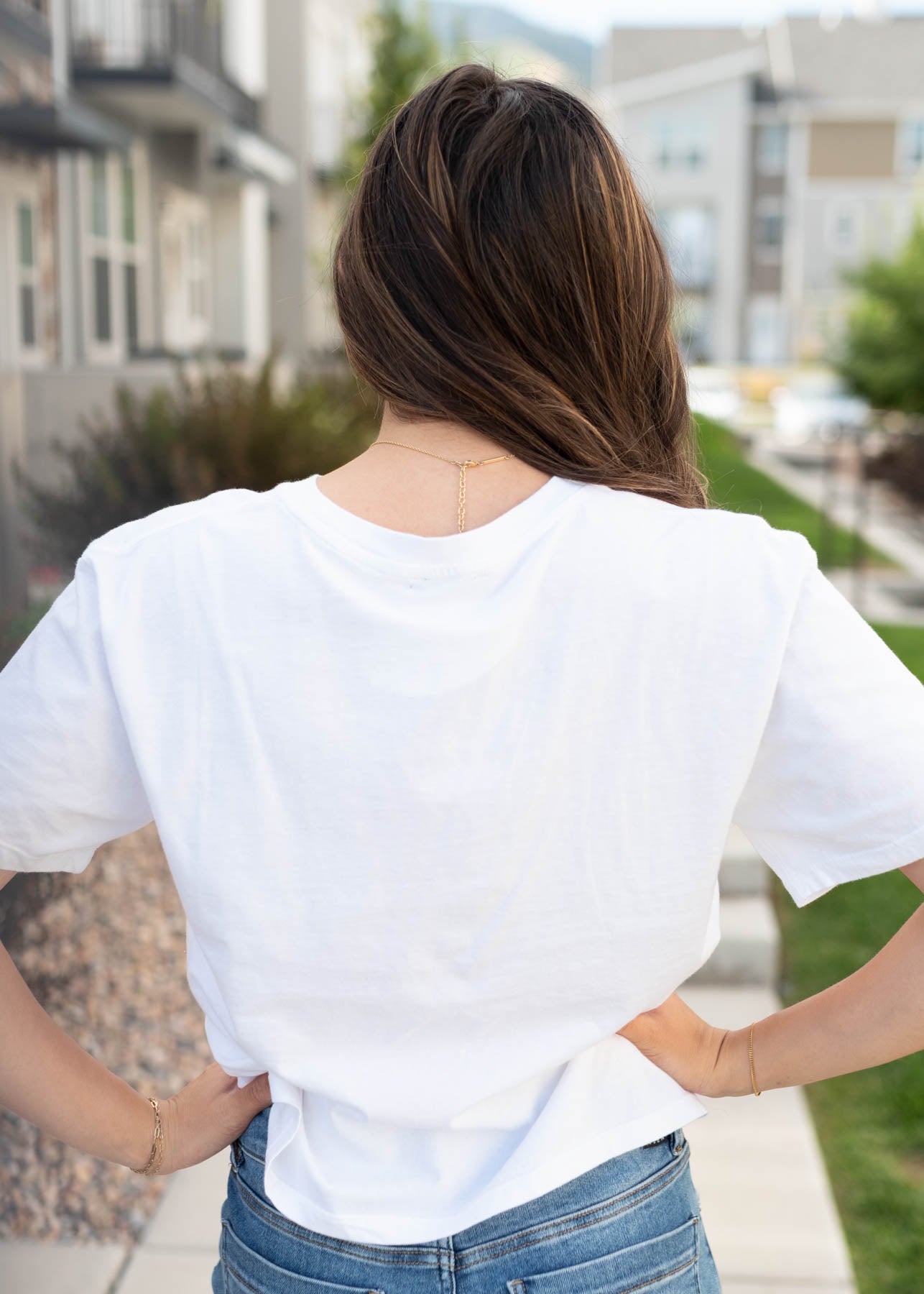 Back view of the white blue bow graphic tee