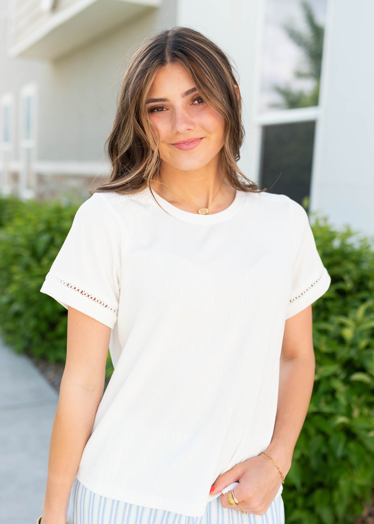 Ivory top with with detail on the sleeves