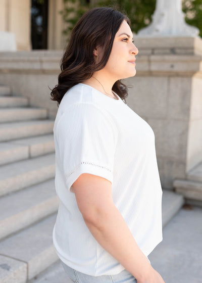 Side view of the plus size ivory top