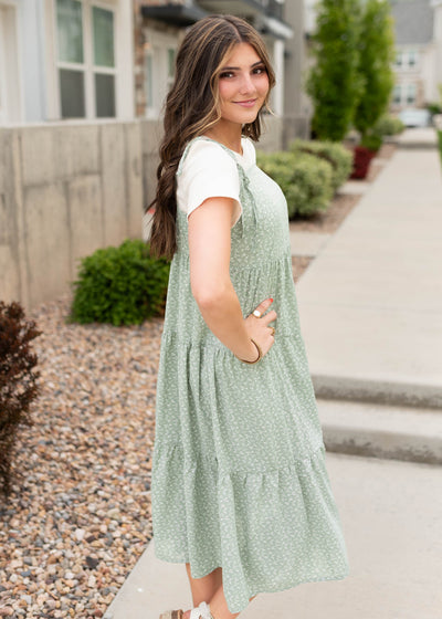 Side view of the sage floral print shoulder tie dress