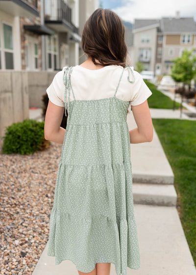 Back view of the sage floral print shoulder tie dress