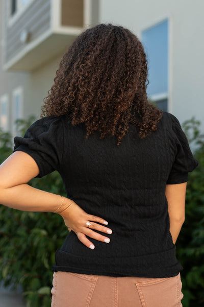 Back view of a black top
